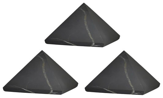 Shungite World 60mm desktop pyramid for energy balance beside electronics