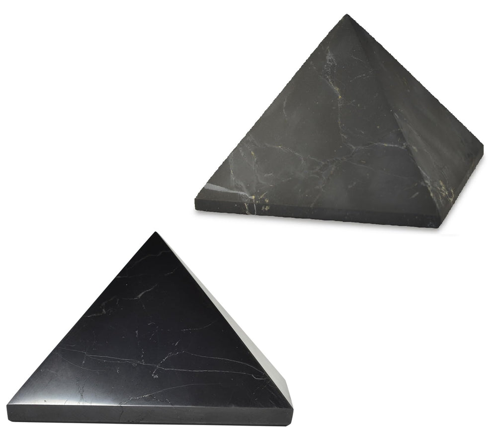 Shungite World two-pcs pyramids polished and unpolished 110 mm on a sleek desk for focus