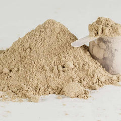 SINGHS Kava powder stirred into tea in a mug for versatile use.
