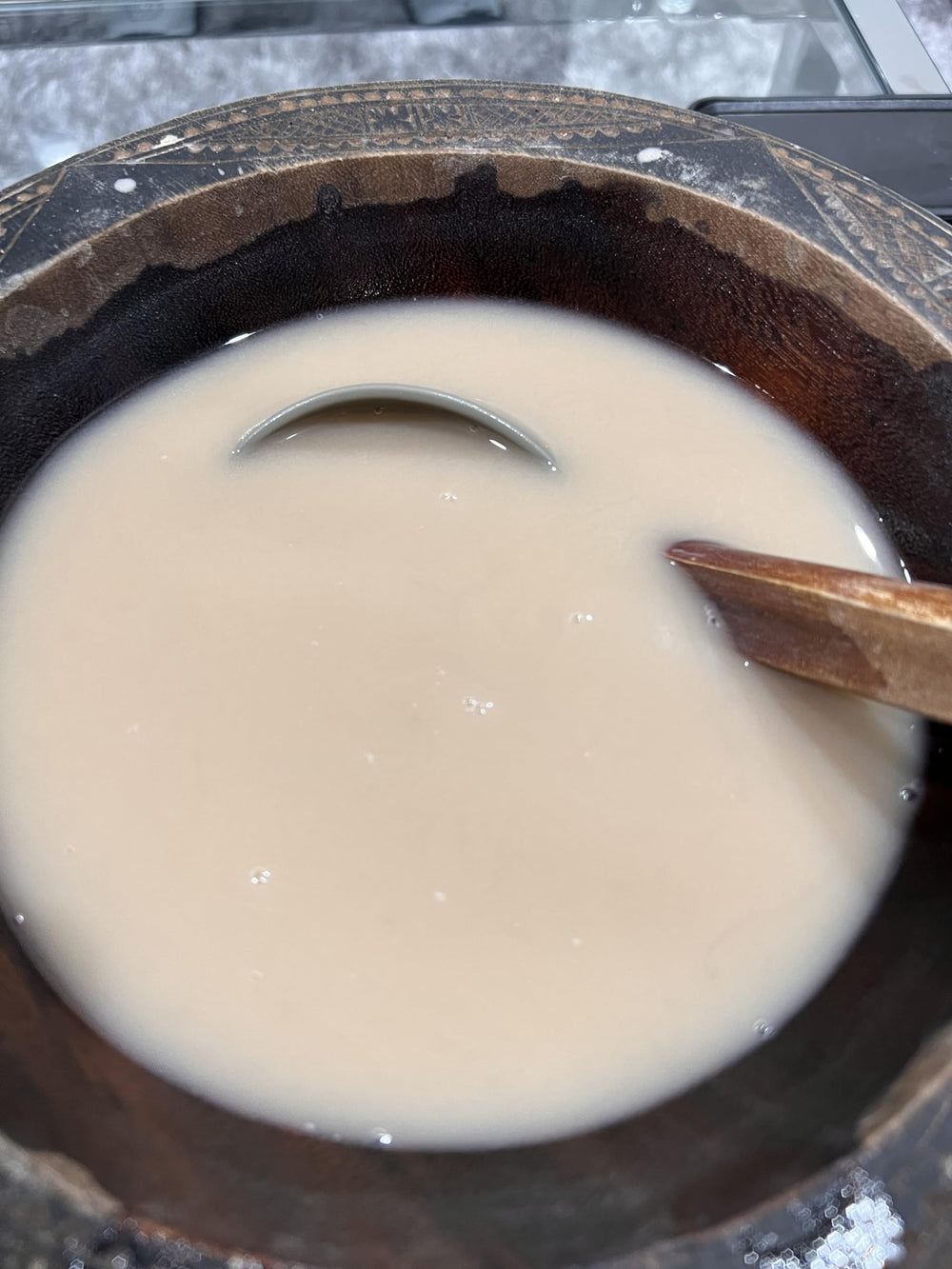 SINGHS kava enjoying a relaxing moment with a warm beverage.