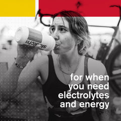 Cyclist adds Skratch Labs Hydration to bottle mid-ride.