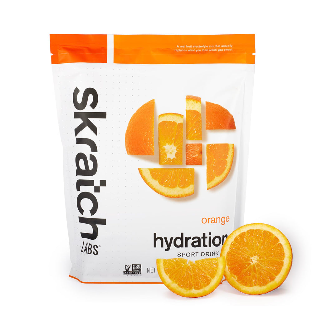 Skratch Labs Hydration Orange bottle being poured for quick electrolyte replacement.