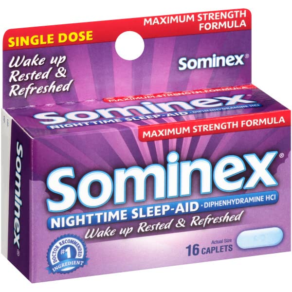 Sominex sleep aid on bedside table during a quiet night.