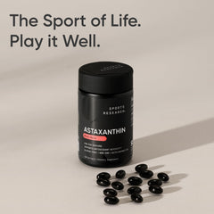 Sports Research Astaxanthin capsule closeup emphasizing daily antioxidant support.