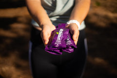 SPRING Speednut gel being squeezed for endurance during activity.