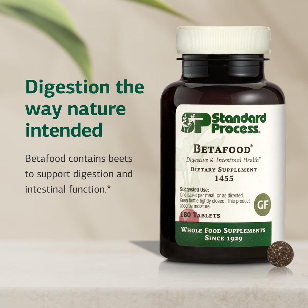 Betafood bottle on kitchen counter illustrating gluten-free vegan supplement use.