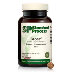 Standard Process Biost bottle with tablets supporting bone and cellular health.