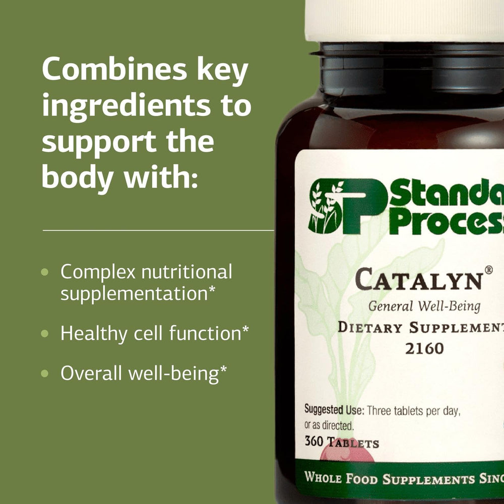Standard Process Catalyn bottle in hand during a daily routine