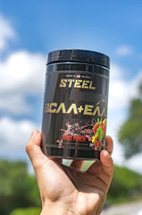 Steel Supplements BCAA EAA powder mixed in glass for endurance use.