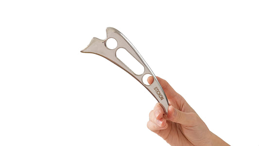 Stickon Gua Sha tool with mirror finish for precise soft tissue mobilization.