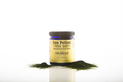 Sun Potion chlorella powder bottle top view, eco-friendly packaging