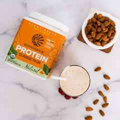 Sunwarrior unflavored protein shake glass featuring a creamy, neutral flavor for versatile recipes.
