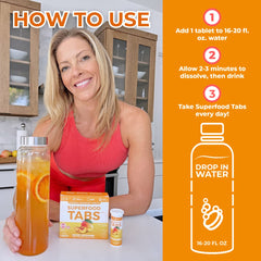 Superfood Tabs Peach Mango glass serving shows a refreshing, sugar-free energy lift.