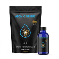 Suspended Solutions Atomic ORMUS bottle on desk, suggesting memory recall support and focus.