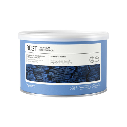Synchro Rest Sleep powder dispensed with a measuring scoop for a calm night.