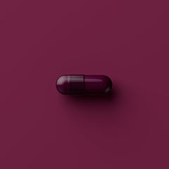 Tally Health capsules in hand illustrate simple dosing for daily wellness goals.