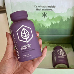 Terra Health Essentials Advanced Probiotics capsules in hand for everyday use