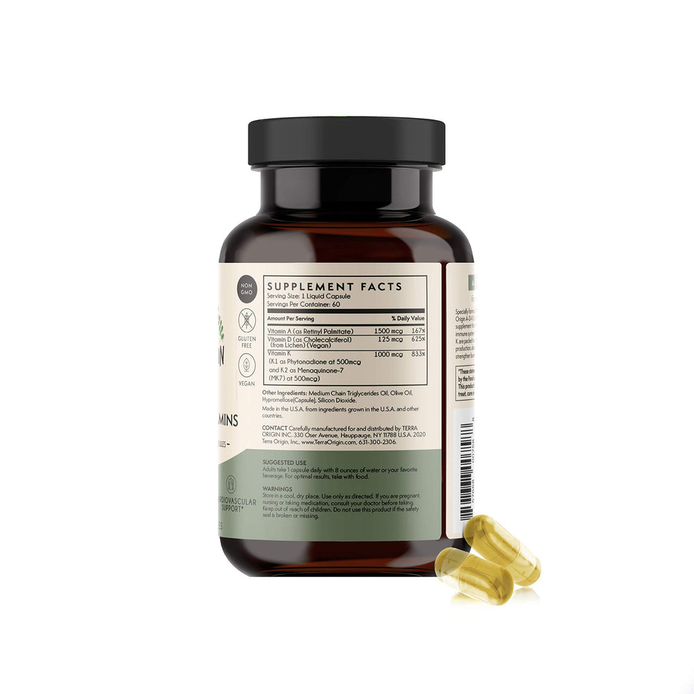 Holding Terra Origin ADK bottle for daily wellness routine