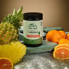 TERRA ORIGIN Healthy Greens bottle in juice demonstrates simple daily use