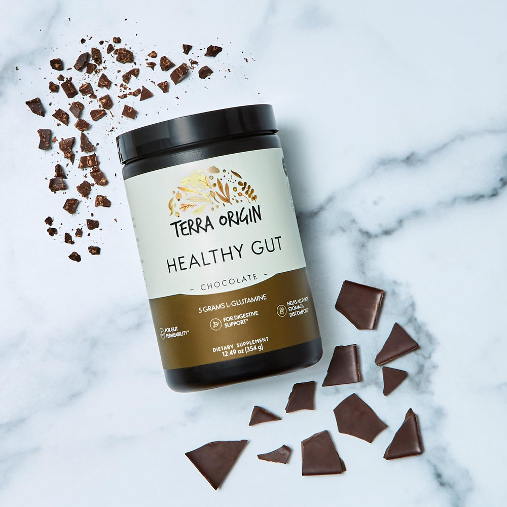 Terra Origin Healthy Gut Chocolate glass with powder being mixed smoothly