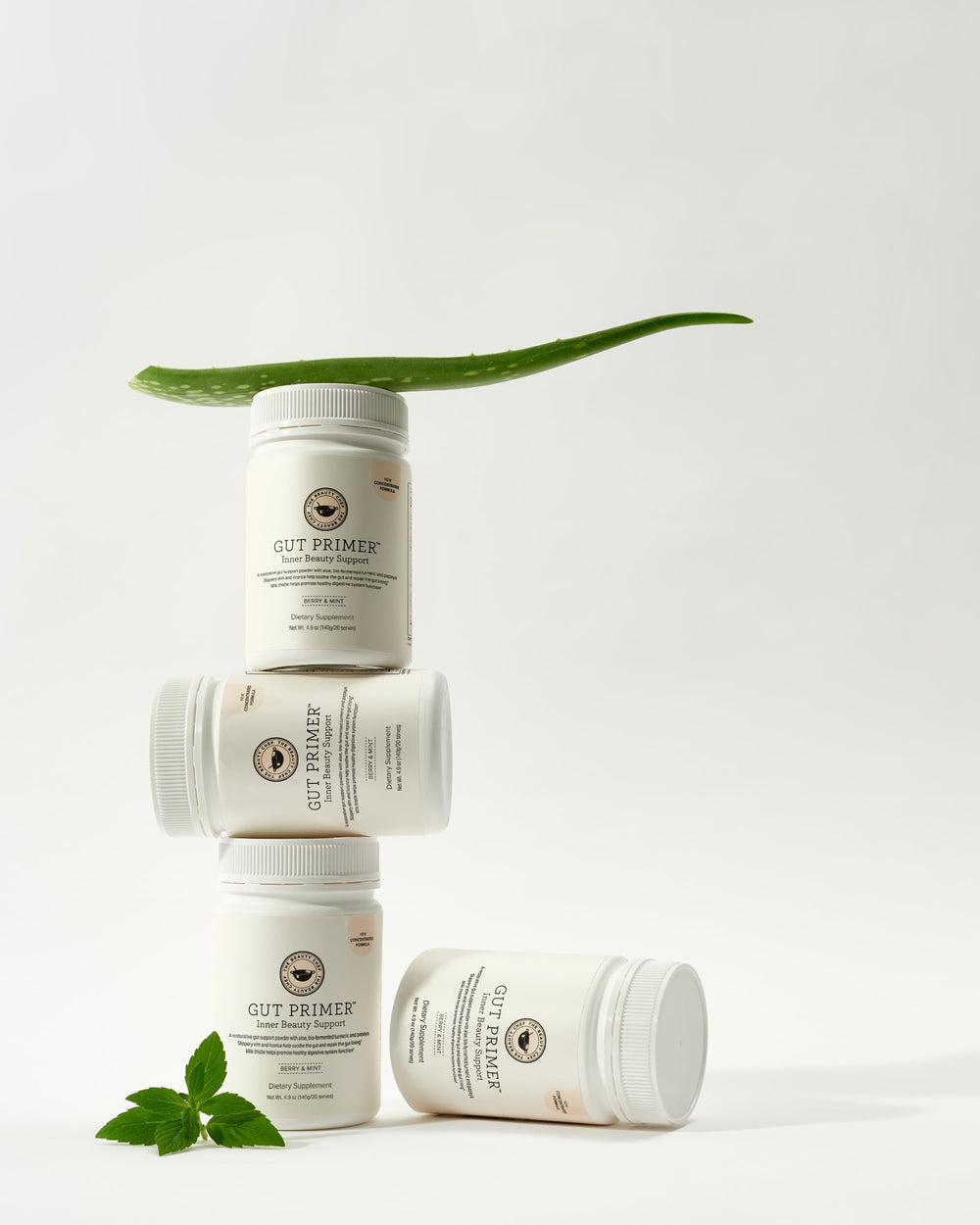 The Beauty Chef Gut Primer bio-fermented formula shown as a probiotic-rich blend.
