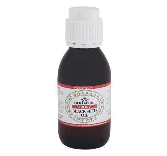 The Blessed Seed strong black seed oil bottle front, premium cold-pressed oil for daily wellness.