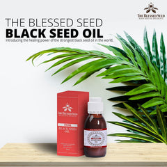 The Blessed Seed oil pour spout image, convenient dispensing without mess.