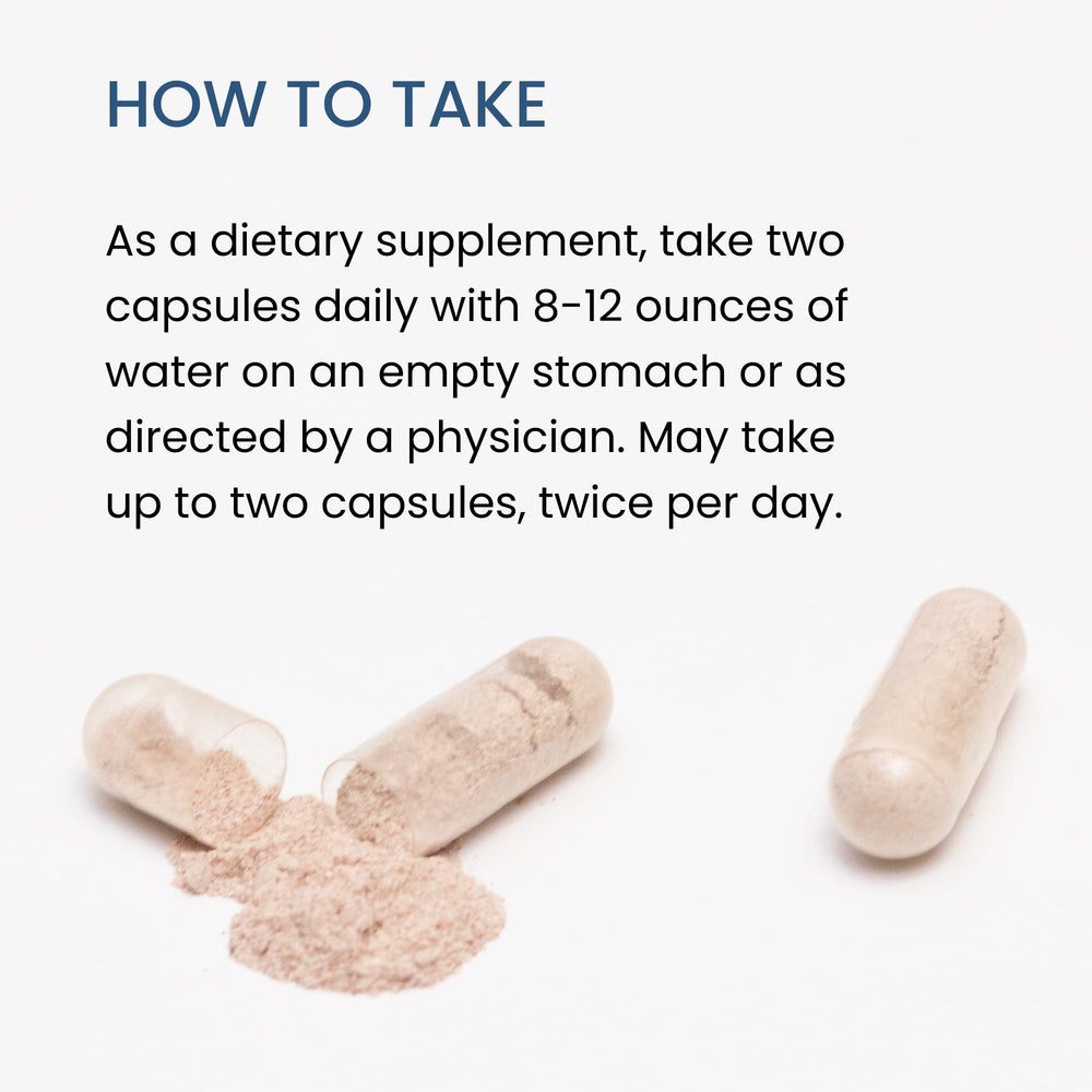 The Wellness Company Spike Support bottle on desk, ready for your wellness routine.