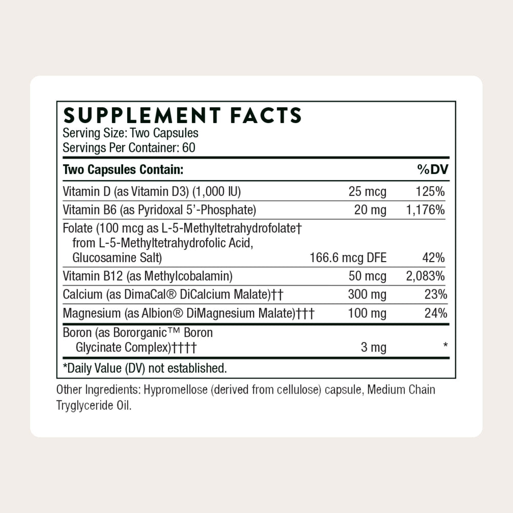 THORNE Advanced Bone Support capsules close-up shows small, easy-to-swallow tablets for daily use.