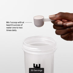 Pouring THORNE Amino Complex into a glass after training