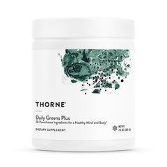 Thorne Daily Greens Plus bottle in kitchen for daily wellness routine.