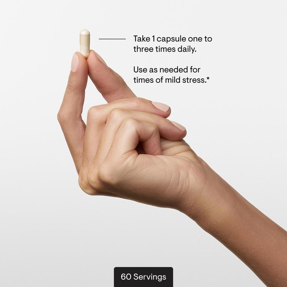 Thorne PharmaGABA-100 capsules in hand for easy daily dosing.