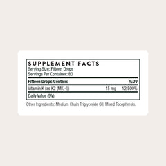 THORNE Vitamin K2 Liquid dropper dispensing a precise 1 mg drop for dosing accuracy.