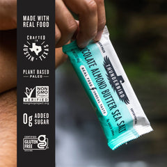 Thunderbird Bars bite-shot shows chocolate almond butter sea salt texture.