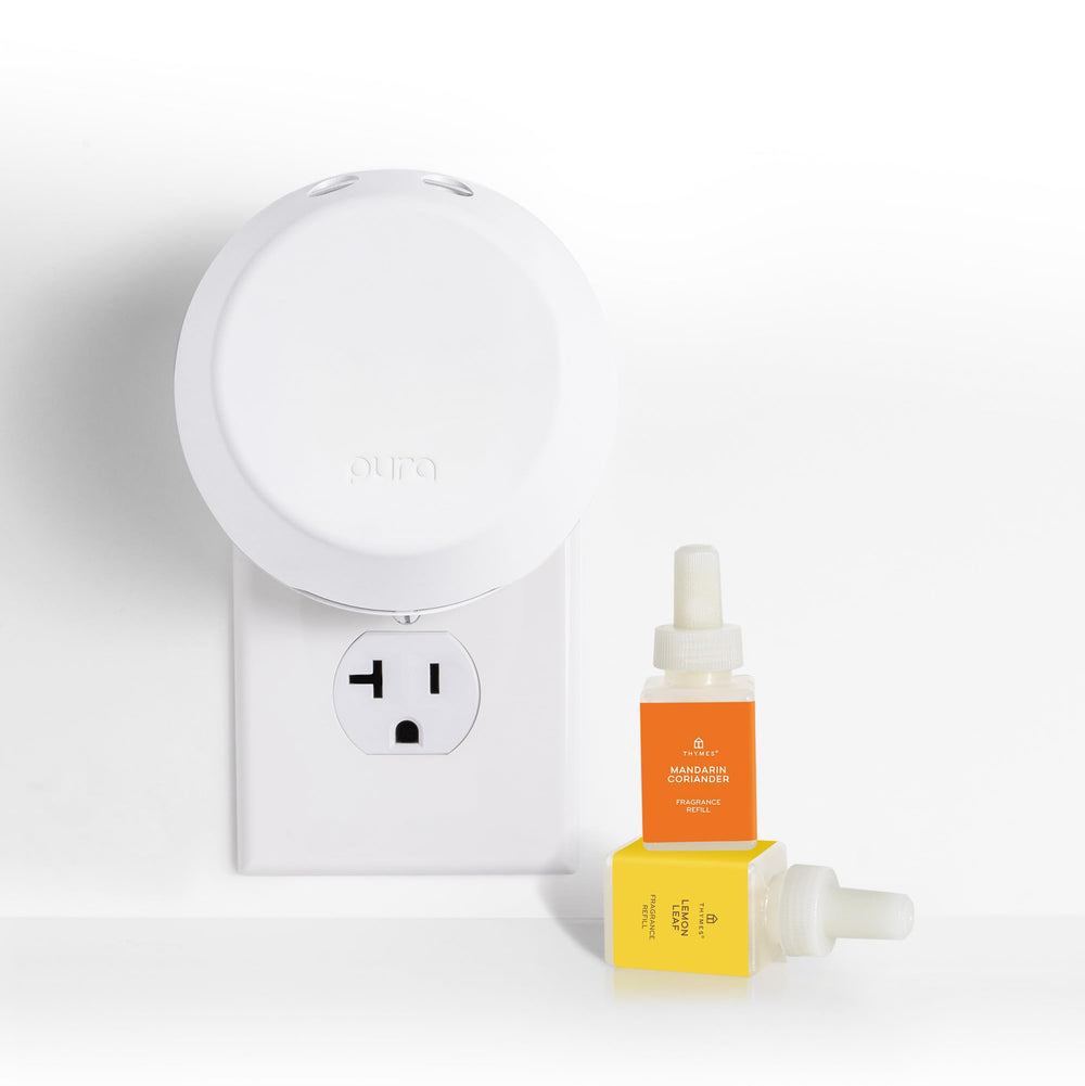 Thymes Pura diffuser in a cozy living room with adaptive diffusion