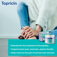 Hands applying Topricin foot cream for targeted comfort.