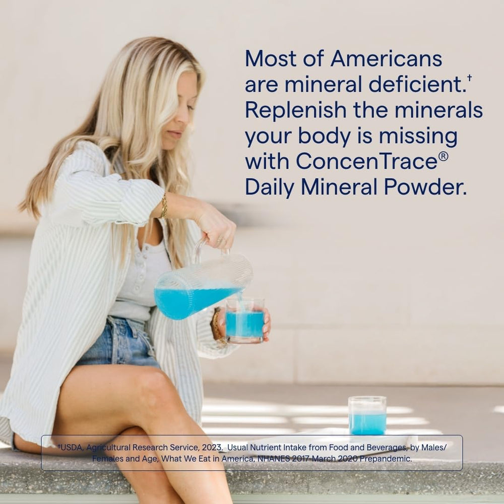 Pouring ConcenTrace powder into a glass for remineralization