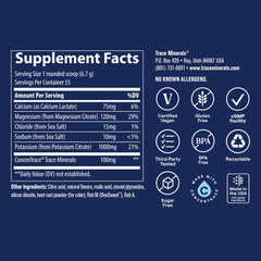 Trace Minerals Keto Electrolyte Powder measuring scoop over a glass of water