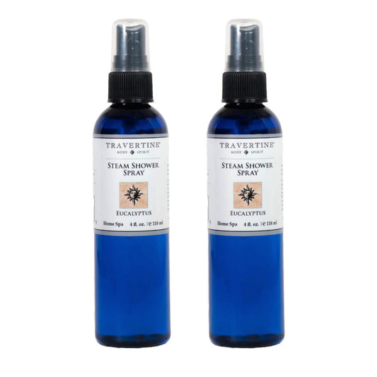 Travertine Spa 4oz bottle releasing eucalyptus aroma for a spa-like shower experience.