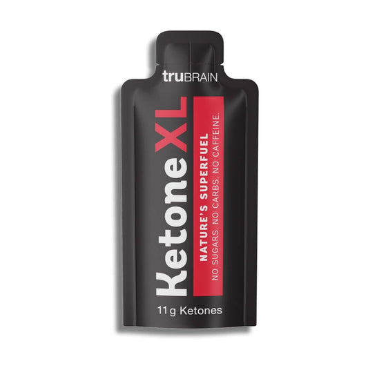 TruBrain Ketone XL lemonade shot bottle on desk for steady energy during study sessions