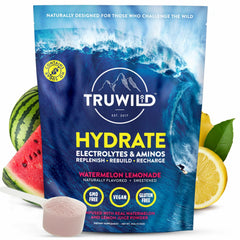 TruWild Hydrate powder poured into a glass for on-the-go hydration