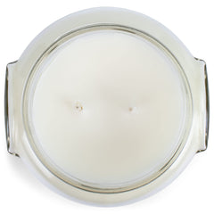 Tyler Creamy White 11 oz glass jar candle on a counter for decor.