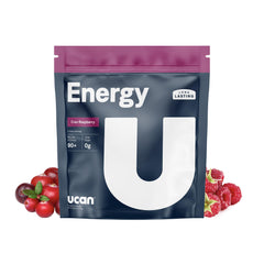 UCAN Energy Powder Cran-Raz canister on gym surface showing long-lasting energy for workouts.