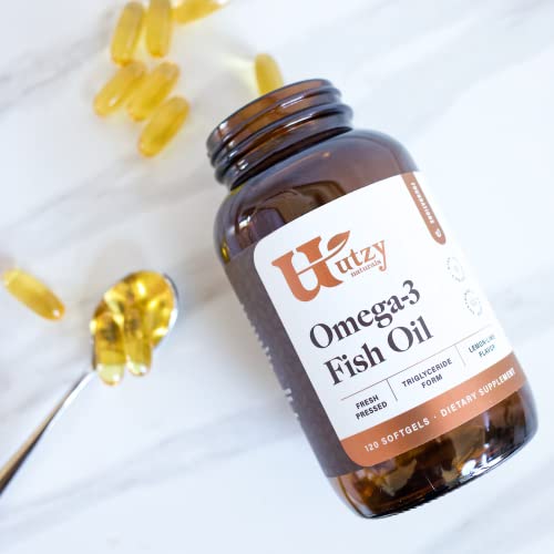 Utzy Naturals Omega-3 softgels pouring into a glass for easy daily use.
