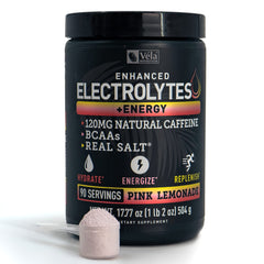 Véla athlete ready for training with a refreshing pink lemonade electrolyte drink.