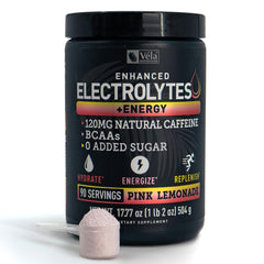 Véla pre-workout electrolyte pink lemonade bottle ready for hydration and energy during workouts.