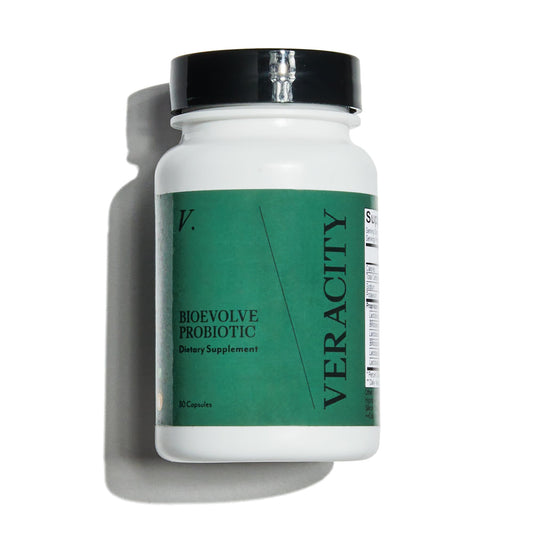Veracity Metabolic Defense bottle with pour, ideal for daily probiotic use.