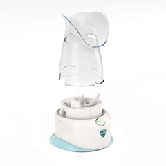 Soft hood resting on the face of a user with the Vicks inhaler.