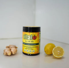 Vital All-in-One Daily Greens Powder tub exposing vegan formula and ingredients