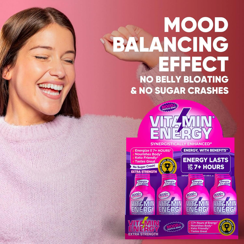 Vitamin Energy Mood+ travel-friendly bottle beside passport and headphones